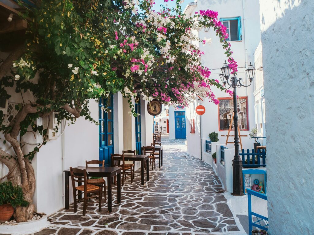 Whitewashed lane with bougainvillea on a Cycladic island